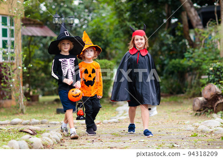 Kids trick or treat. Halloween fun for children. 94318209