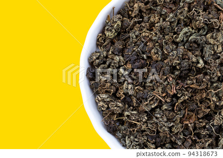 Dried Jiaogulan on yellow background. 94318673