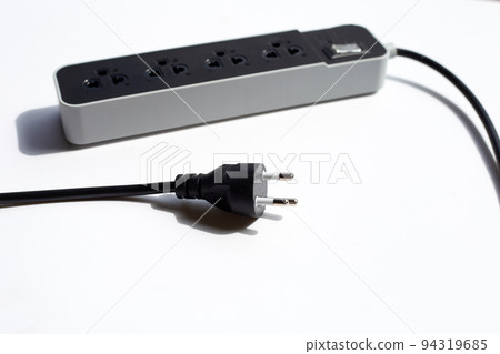Electrical power strip and plug on white background. Electrical power strip and plug on white background. 94319685