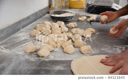Baker shaping dough 94321645
