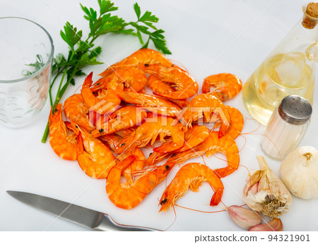 Seafood appetizer. Roasted langostins served with parsley Seafood appetizer. Roasted langostins served with parsley 94321901