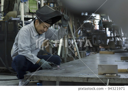 Welder image Middle male worker welding TIG welding Welder image Middle male worker welding TIG welding 94321971