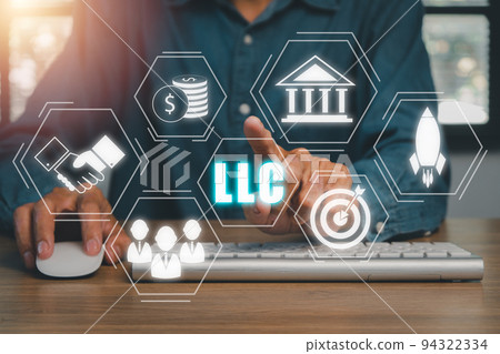 Limited Liability Company (LLC) Business Concept, Person hand using computer and hand touching limited liability company icon on Vr screen. 94322334