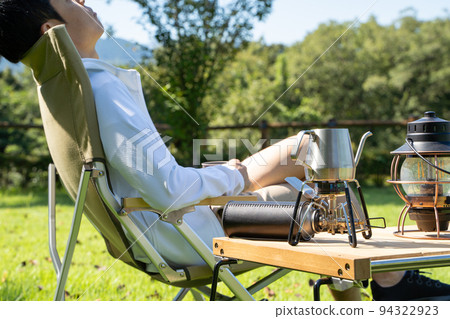 Man relaxing outdoors 94322923