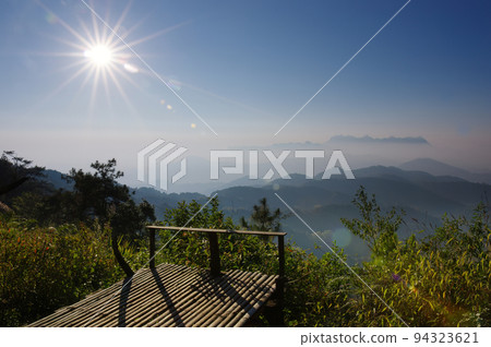 Aerial View of Doi chiang dao mountains in the morning and the sea of mist, Doi Kham Fa. Chiang Mai Province, Thailand. Pink cherry blossom. Aerial View of Doi chiang dao mountains in the morning and the sea of mist, Doi Kham Fa. Chiang Mai Province, Thailand. Pink cherry blossom. 94323621