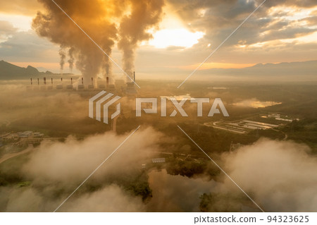 Aerial view coal power plant station in the morning mist, the morning sun rises. coal power plant and environment concept. Coal and steam. Mae Moh, Lampang, Thailand. Aerial view coal power plant station in the morning mist, the morning sun rises. coal power plant and environment concept. Coal and steam. Mae Moh, Lampang, Thailand. 94323625
