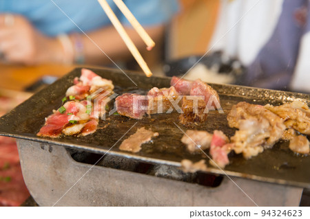 Top view of dice beef and Striped calf beef on the pan and stove 94324623