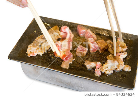 Top view of dice beef and Striped calf beef on the pan and stove, focus selective Top view of dice beef and Striped calf beef on the pan and stove, focus selective 94324624