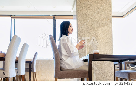 Young woman waiting for food in a restaurant Young woman waiting for food in a restaurant 94326458