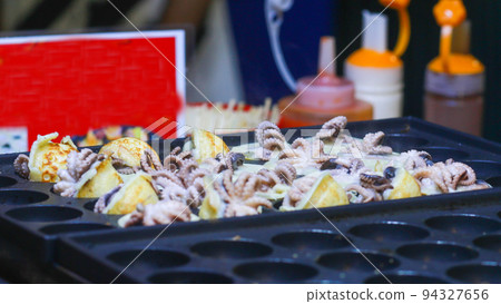 Takoyaki being prepared in Ho Thi Ky street food Takoyaki being prepared in Ho Thi Ky street food 94327656