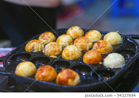 Takoyaki being prepared in Ho Thi Ky street food Takoyaki being prepared in Ho Thi Ky street food 94327694