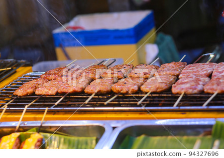 grill sour meatball in ho thi ky street, ho chi minh city 94327696