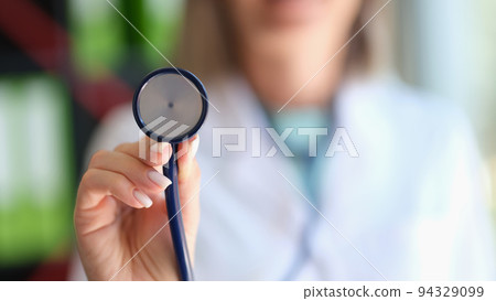 Closeup of cardiologist doctor holding a stethoscope 94329099