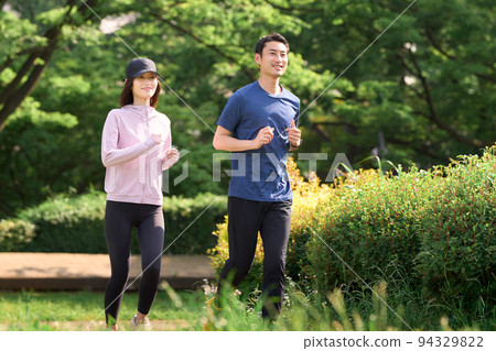Men and women running in the park exercise image Men and women running in the park exercise image 94329822
