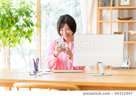 A young lady with a smartphone A young lady with a smartphone 94332947