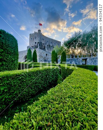 Tower with Georgian flag at old Akhaltsikhe Castle 94334317