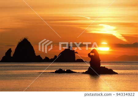 The sun sets over Godzilla Rock 94334922