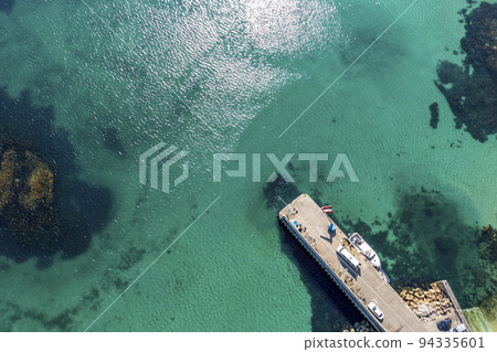 Aerial view of the pier at Leabgarrow on Arranmore Island in County Donegal, Republic of Ireland 94335601