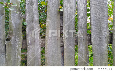 Weathered curved board fence Weathered curved board fence 94336045
