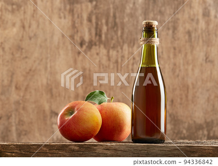 Apple vinegar cider with apple fruit on old wooden background. 94336842