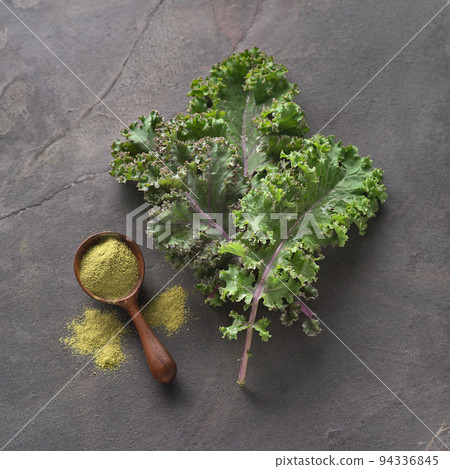 Kale salad with kale powder on graphite background 94336845