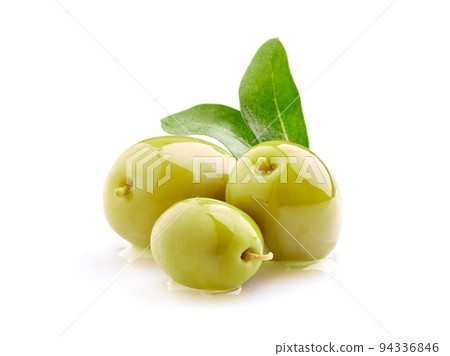Green olives in closeup on white background 94336846