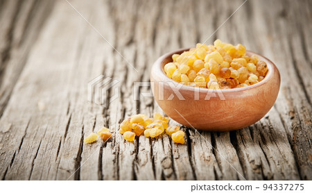 Frankincense resin on wooden background Frankincense resin on wooden background 94337275