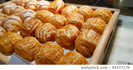 Assorted fresh baked sweet puff pastry stuffed with fruit and jelly and danish chocolate fill pastry, super delicious warm fresh buttery French and American baked pastries are enjoyed world wide on ba Assorted fresh baked sweet puff pastry stuffed with fruit and jelly and danish chocolate fill pastry, super delicious warm fresh buttery French and American baked pastries are enjoyed world wide on ba 94337276