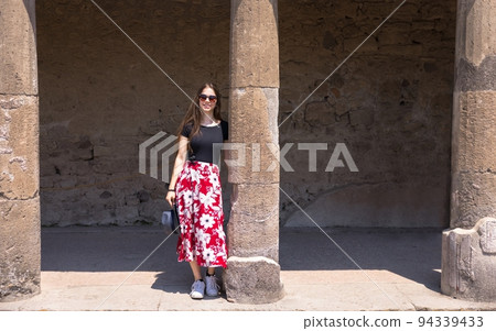 Travel photo of woman amongs some ancient ruins Travel photo of woman amongs some ancient ruins 94339433