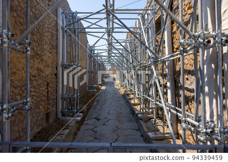 Old building scaffolding ready to be renovated 94339459