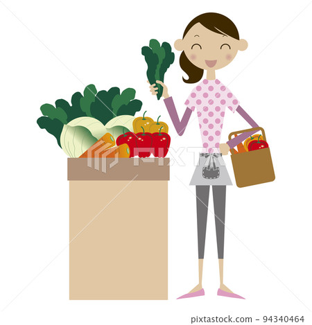 Woman in pink polka dot t-shirt choosing spinach while shopping for groceries 94340464