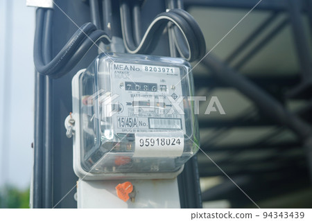 Bangkok, Thailand - May 15, 2022 Electric measuring power meter for energy cost at home and office. 94343439