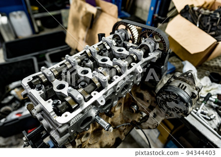 Disassembled car engine block at car service station Disassembled car engine block at car service station 94344403