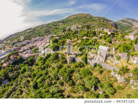 Old city. Sunny view of ruins of citadel in Stari Bar town near Bar city, Montenegro. Drone view Portrait of a disgruntled girl sitting at a cafe table 94345185