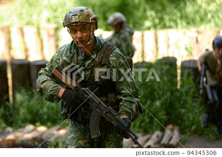 Young military soldiers during military maneuver training 94345306