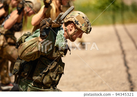 Young military soldiers during military maneuver training 94345321