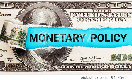 Monetary policy. Torn bills revealing Monetary Policy words. Ideas for Increase or Decrease interest Monetary policy. Torn bills revealing Monetary Policy words. Ideas for Increase or Decrease interest 94345604