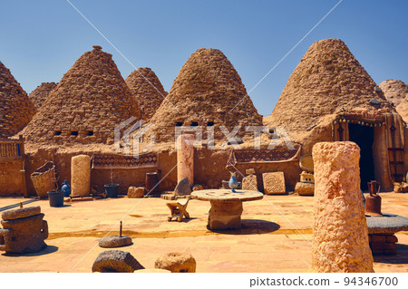 Beehive houses opposite bright clear sky Beehive houses opposite bright clear sky 94346700