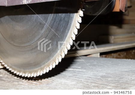 Industrial saw blade with serrations close up Industrial saw blade with serrations close up 94346758
