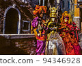 Revelers wearing costumes at the Venice Carnival 94346928