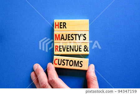 HMRC her majestys revenue and customs symbol. Concept words HMRC her majestys revenue and customs on blocks on beautiful blue background. Business HMRC revenue and customs concept. Copy space. HMRC her majestys revenue and customs symbol. Concept words HMRC her majestys revenue and customs on blocks on beautiful blue background. Business HMRC revenue and customs concept. Copy space. 94347159