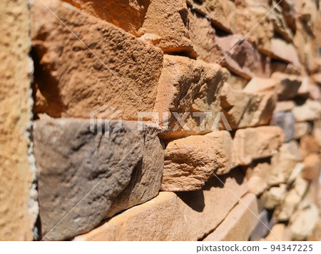 Artificial stone cladding. Designed to resemble real stone. Arranged vertically and attached to the wall with a special adhesive. Used as decoration on the walls of buildings. 94347225