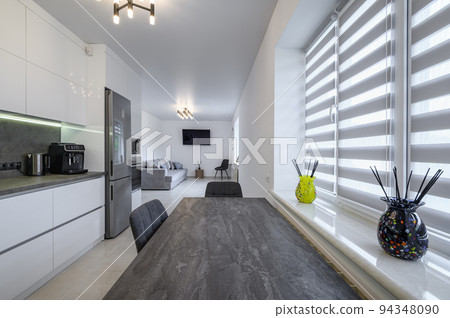 Luxurious white kitchen with granite counter top 94348090