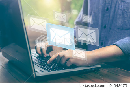 Business man hand working on Laptop with email illustration. email marketing concept, company sending many emails or digital newsletter to customers. 94348475