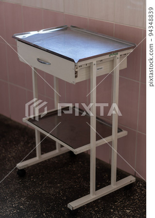 Image of old pink gynecological chair in toffice room professional clinic with copy space. Pregnancy Planning parturition lying-in maternity pain obstetrics Concept Image of old pink gynecological chair in toffice room professional clinic with copy space. Pregnancy Planning parturition lying-in maternity pain obstetrics Concept 94348839