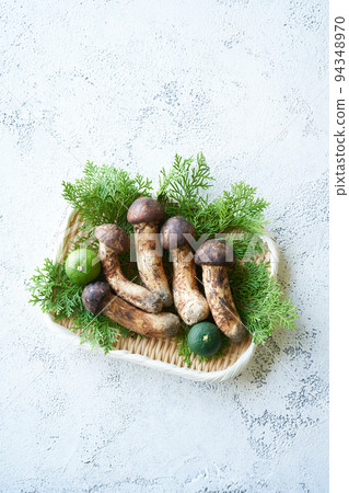 Domestic matsutake mushrooms served in a colander Domestic matsutake mushrooms served in a colander 94348970