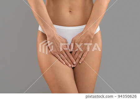 Women Health Concept. Unrecognizable Woman In Underwear Covering Her Panties With Palm Women Health Concept. Unrecognizable Woman In Underwear Covering Her Panties With Palm 94350626