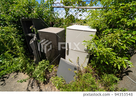 Refrigerator illegally dumped on the roadside Refrigerator illegally dumped on the roadside 94353548