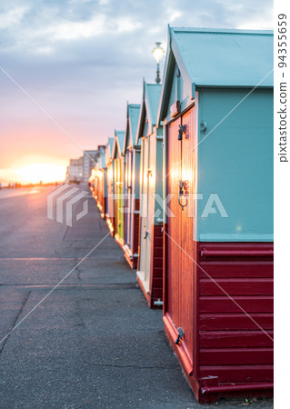 Colorful Beach Huts during sunset at Brighton and Hove, England 94355659