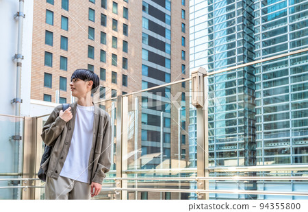 Office casual young businessman in front of Shinbashi station 94355800